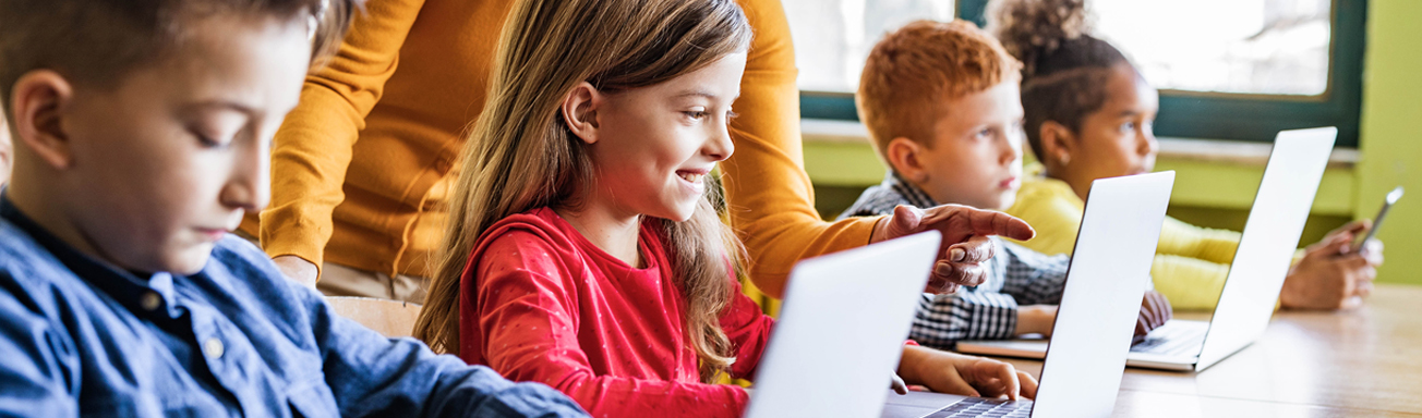 School children using devices in the classroom