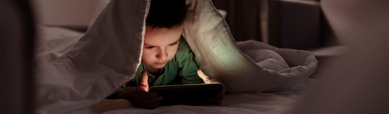 boy playing with tablet