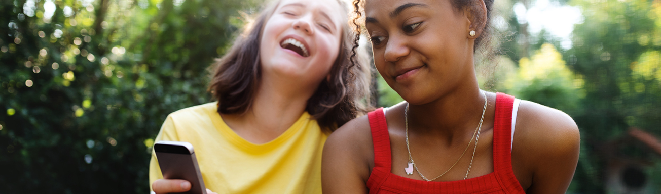Kids smiling with their phones