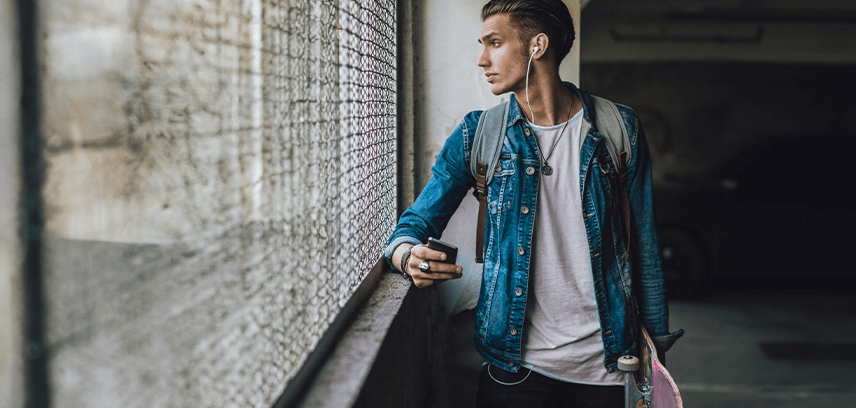 teenage boy looking out window