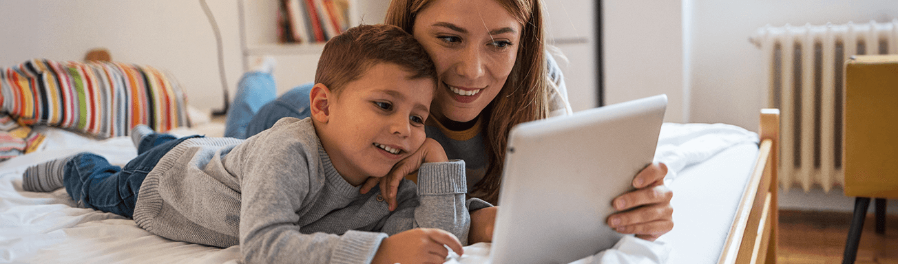 mother and son using tablet