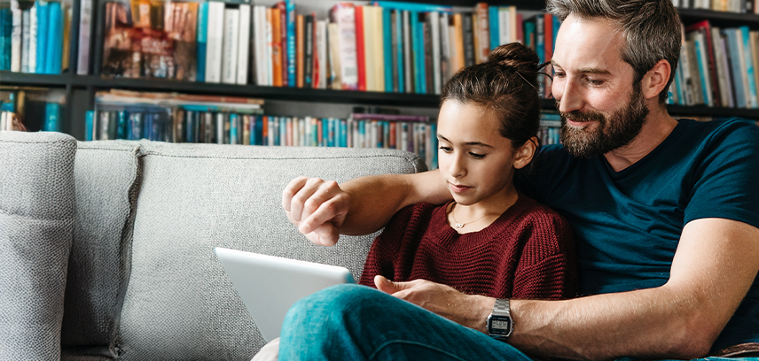 Father and daughter using tablet