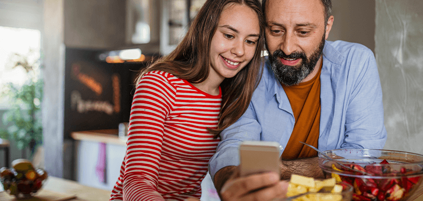 Father helping daughter use X/Twitter safely