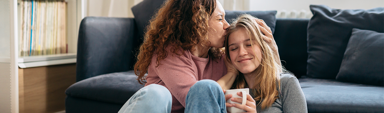Mother comforting daughter